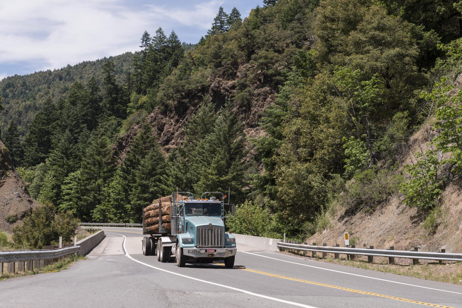 A truck on a two-lane mountain road in California